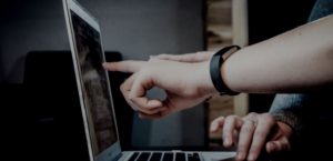 People pointing the desktop screen